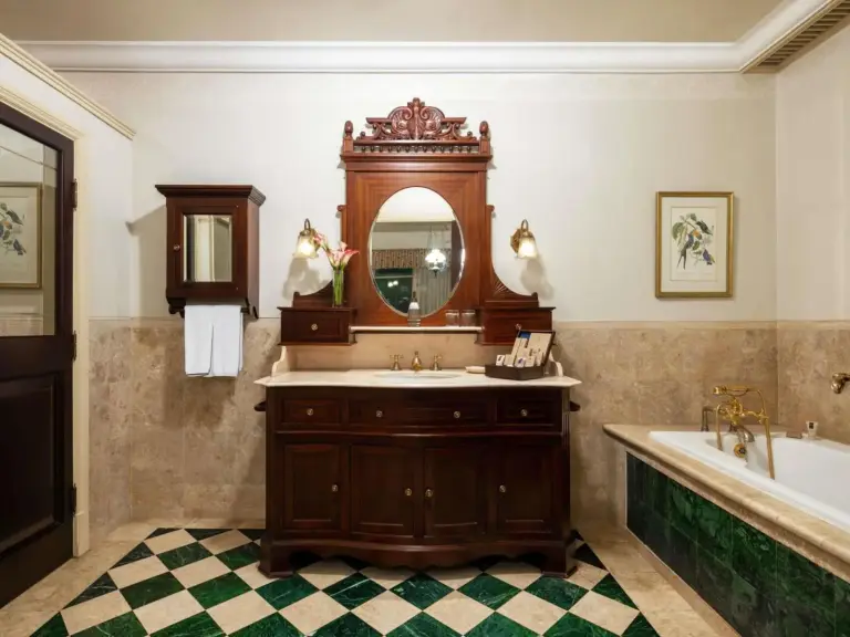 Hotel Majapahit Surabaya MGallery – Surabaya, Indonesia hotel – a bathroom with a sink and a tub and a mirror at Hotel Majapahit Surabaya MGallery in Surabaya